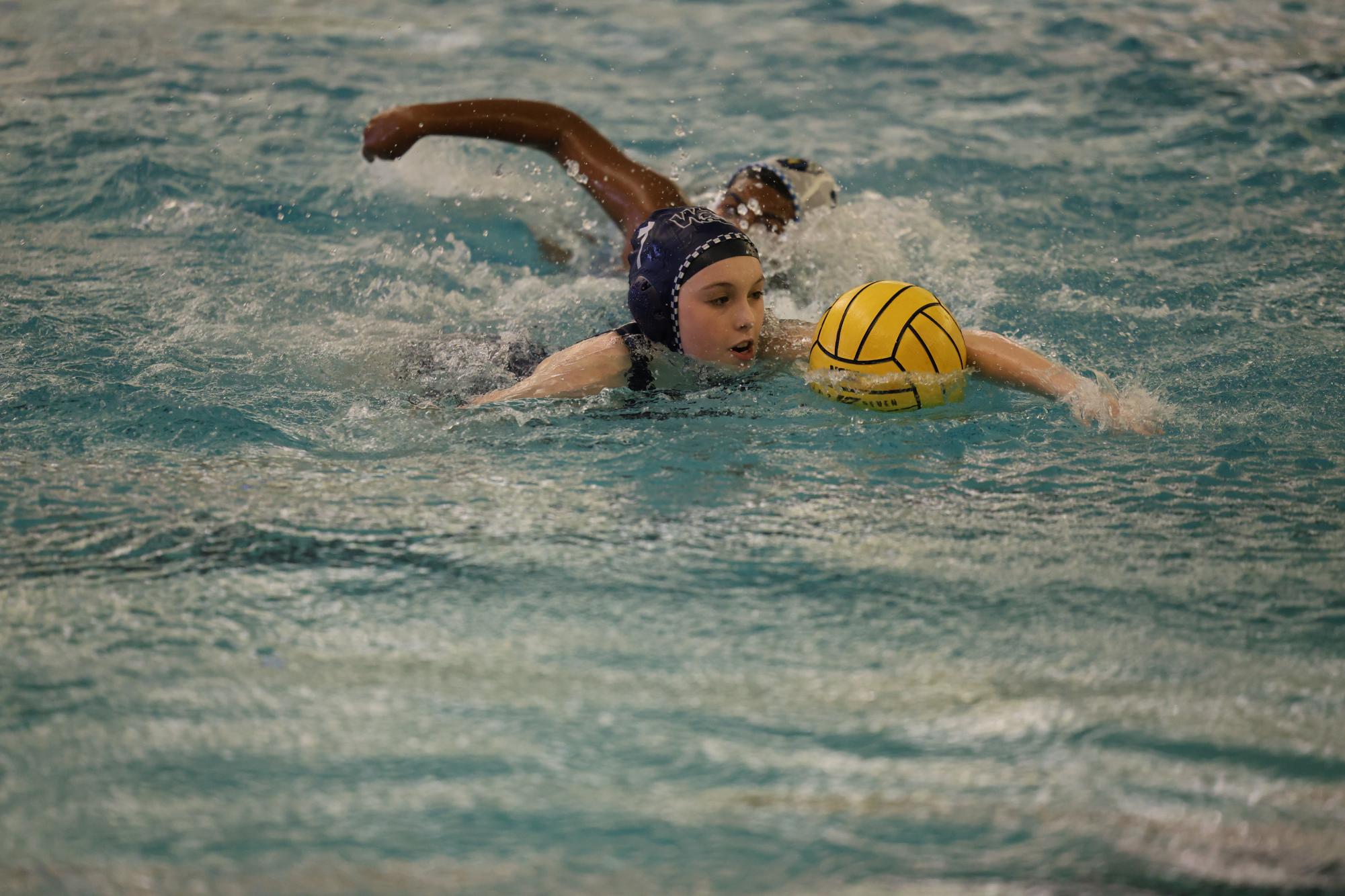 Ready to receive a pass, Taylor Owens, a freshman varsity water polo player swims forward towards the goal. The Senior game against Rock Hill provided an opportunity for many freshmen to get playing time. Owens, Quinn Geyter, and June Horton, all freshmen varsity water polo players new to the sport, got lots of opportunities to showcase their improvement from the first tournament. “It was tough because I hadn’t played that much before.” Geyter said, “But after the goal I scored, everything felt so much better.” This was Geyter’s second goal this season.