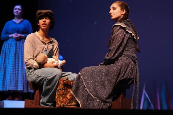 As they sit on a prop boat, sophomore Corvus Mckay and senior Kaelin Eckels perform the last scene of Anatomy of Grey. Mckay portrays the role of Homer, a character about to sail off and start a life with Eckel's character, June. "I liked playing Homer because he is so simple as a person," McKay said, "It was an outlook I have never looked at before. I loved playing a character like that."