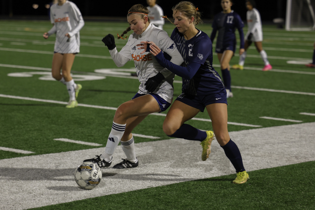 Foot planted, No. 21 Tatum Nielsen wrestles Sachse player for the ball. Nielsen is a junior at Walnut Grove High School and attended Prosper High for two years. The Walnut varsity girls soccer teams motto is All in. Claws out.