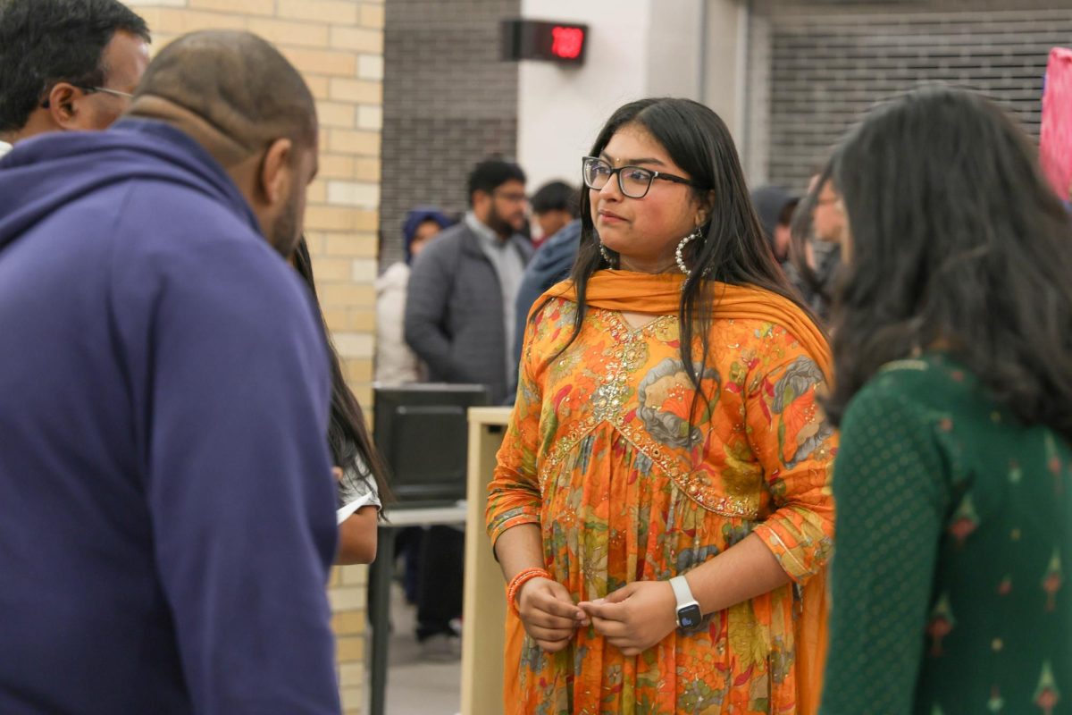 As parents show interest, current freshman Aditi Elluri answers questions regarding the Bollywood Fusion club. Its been really cool to talk to people and see what their kids are interested in, Elluri said. The Bollywood Fusion Club is sure to have new members with their colorful dress and complementary snacks.