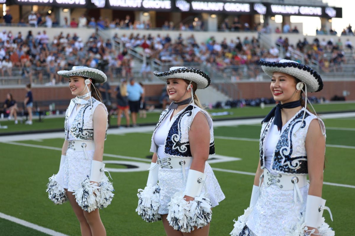 Smile on her face, senior Kaylee Mitchell stands in victory lines. Mitchell has been on Sliver Elites for two years. Mitchell has also been Blue Hawks Rockettes. 