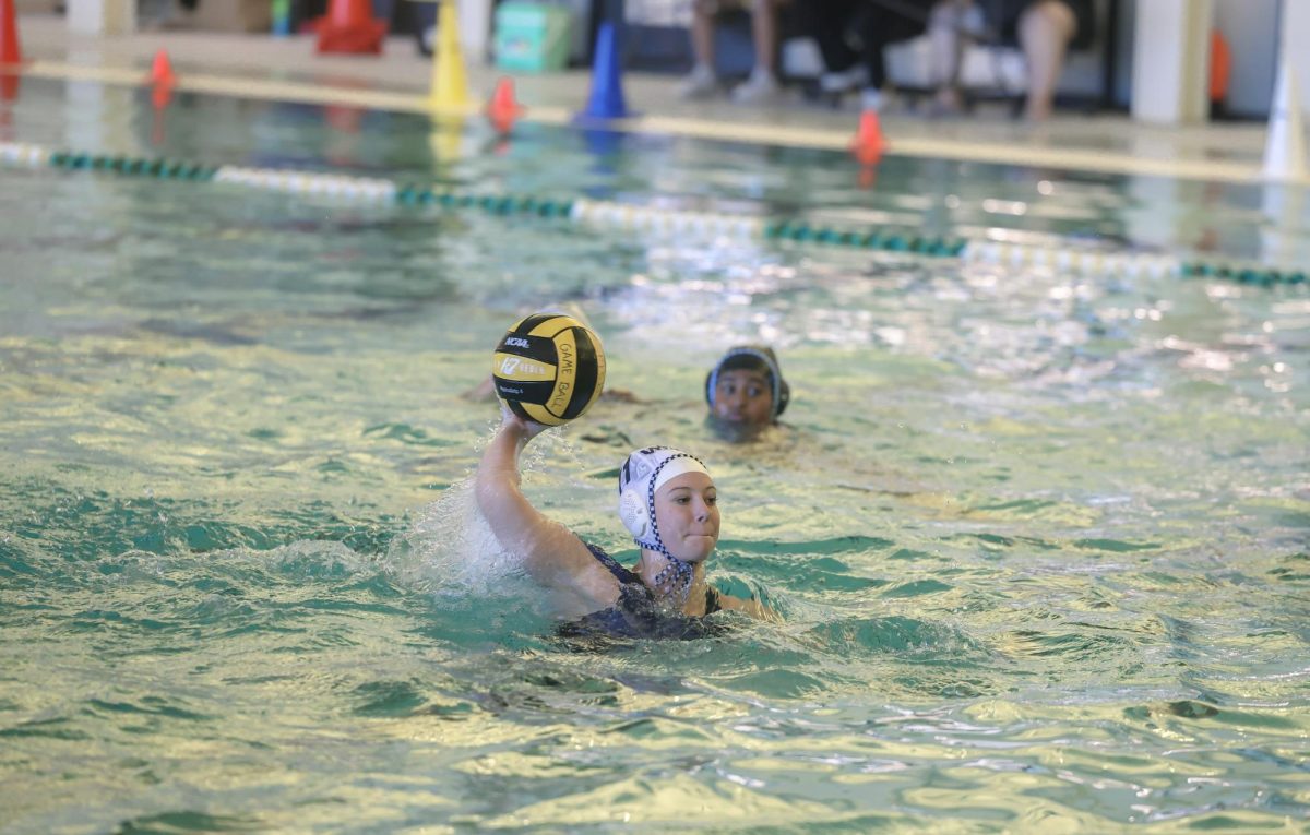 Arm at the ready, No. 11 senior Harper Collins prepares to make her 10th goal of the game. Collins scored 11 total goals throughout the game and 45 goals this season. Collins serves her second year as a Walnut Grove water polo captain. 