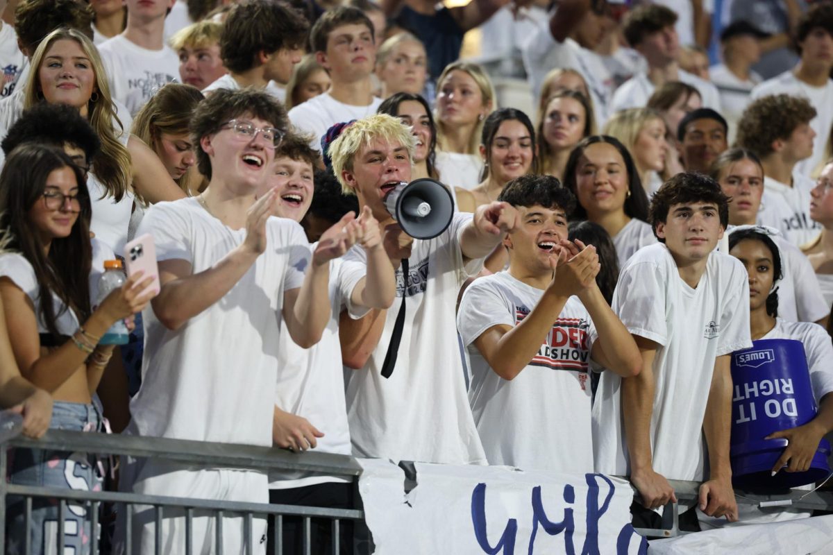 Cheering the football team forward, the student section "whites out" against the Trojans. The Varsity football team played against Newman Smith last Friday and won 63-28. WGHS Varsity football will play Little Elm this week.