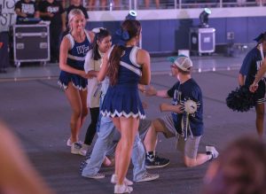 Arms around the flyer, senior Remi Richardson prepares to place sophomore Alyssa Murillo on the knees of junior Dane Miller and junior Dillon Diener. Richardson is one of the founding member of Cheer Cats. “I feel like a big thing with [special education] is that they don’t always have the same opportunities as general education like sports and clubs,” Richardson said. “[Cheer cats] provided an opportunity for them to be on a team and be a part of something.” 