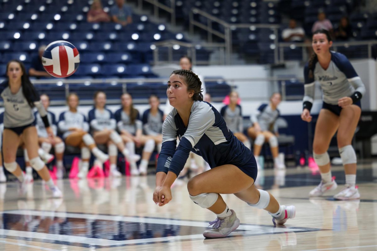 Hands together, No. 1 sophomore Lauren Aguilar  prepares to hit the incoming volleyball. Aguilar also had 3 assits. 