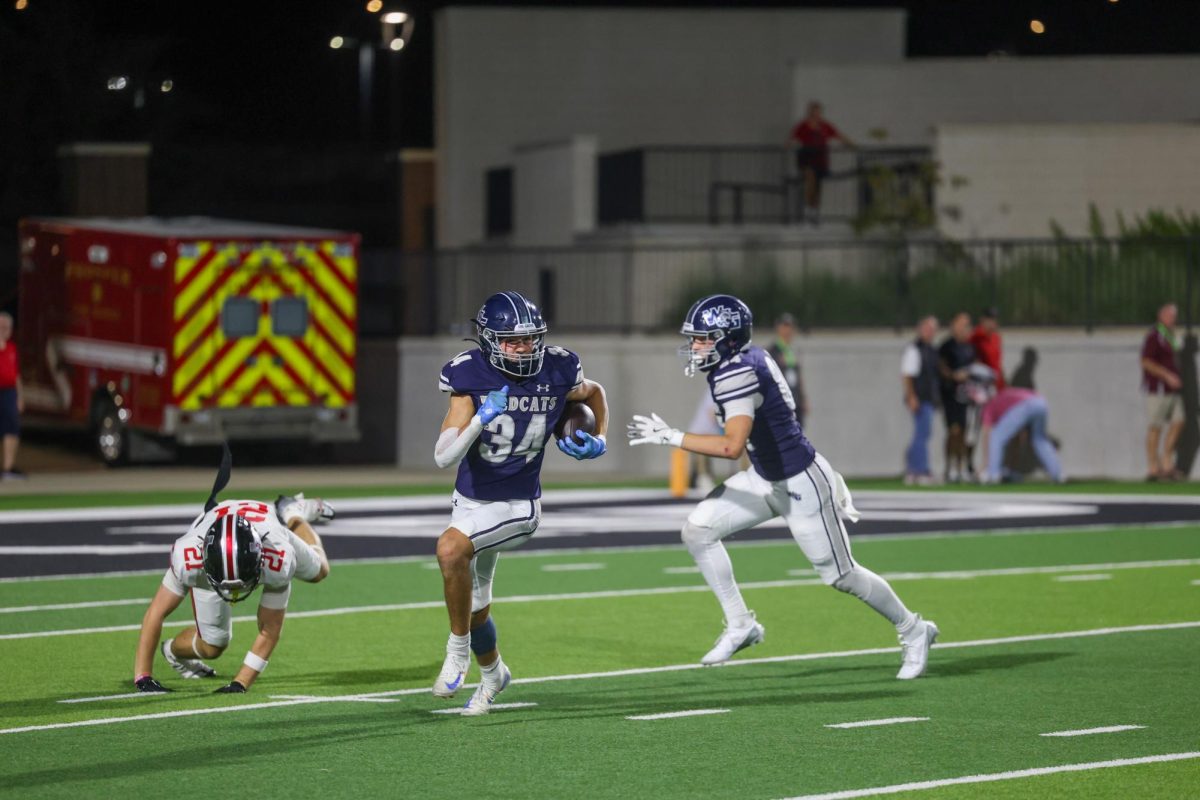 Prepared to run, No. 34 senior Antonie Van tonder runs after catching the kickoff. Van tonder finished the night with 65 yards and 16 return yards. 