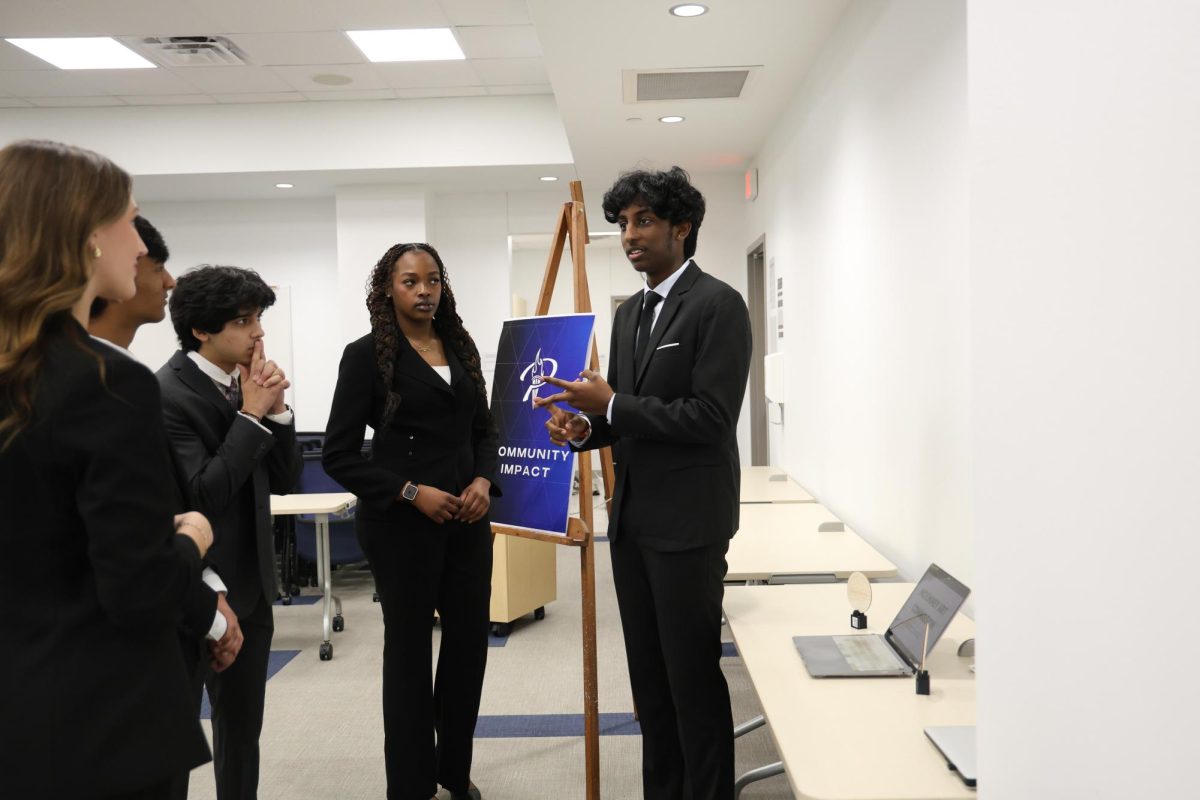 As the PCIS Year 2 students listen, senior Sivashnu Murthy gives his Fall Presentation. He was assigned to speak about an organization making an impact in the community. He chose to learn about the McKinney Art Commission.