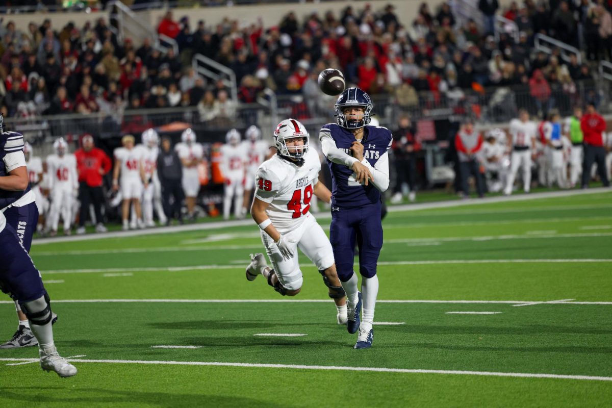 Ball in the air, No. 2 freshman Hayes Hackney throws the ball before getting sacked by the opposing defender. Hackney threw for a total of 329 yards. 