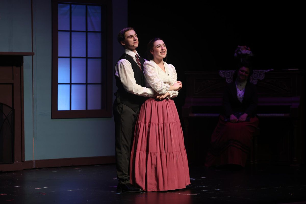 As she dances around the stage junior Clarice Pesce (right) sings 