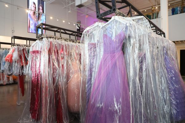 Formal Dresses line in racks at Runway Fashion House in the Gates of Prosper. Runway sells dresses of all kinds for many different occasions, like homecoming and prom. Dresses are documented to ensure the same dress won’t be sold from their store for the same school's prom. 
