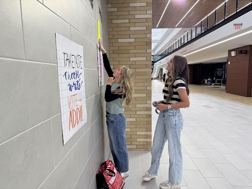 Class officer candidate, Ellery Liber hangs her flier. Class officers are voted on Thursday and announced Friday.