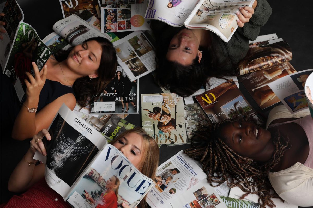 This is a photoshoot of the fashion practicum students: Kylie Corbridge, Malia Sofi, Arianna Day, and Kelsey Rohde. The point of the photoshoot is to show the students gaining inspiration from design magazines such as Vogue in an artistic, chaotic way. 

