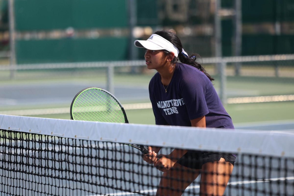 Sanika is focusing on the tennis ball, quickly prepping herself at the area match at Highland Park. This photo was taken by Abbie Fleeman. 