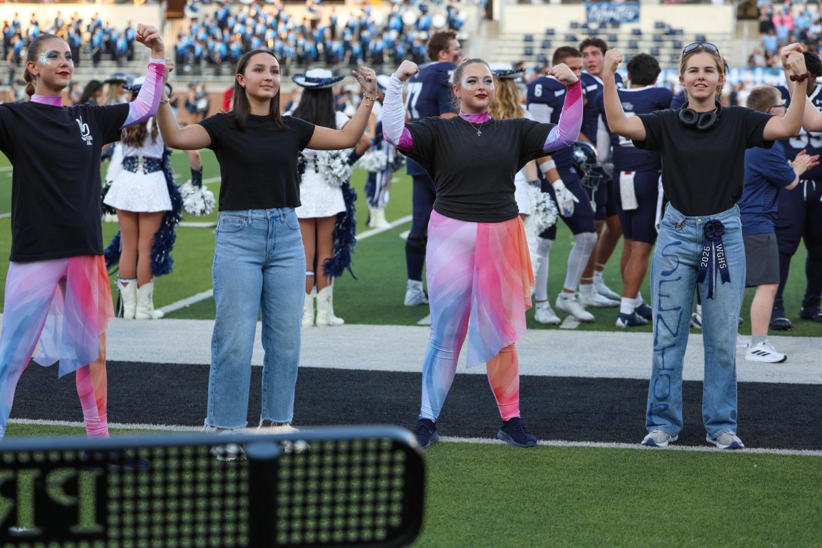 At Children's Health Stadium on September 13, (Left to right) Rissa Warren, Bella Bruce, Jillian Hees, and Lindsay Moffatt sign the national anthem to spread Deaf awareness and to accommodate anyone who may need the signed version of the National Anthem. “Although it can be difficult to sign at the same pace as everyone else,” Lindsay Moffatt said. “signing the national anthem is really fun and fulfilling because I think showcasing the beauty of ASL is important.”