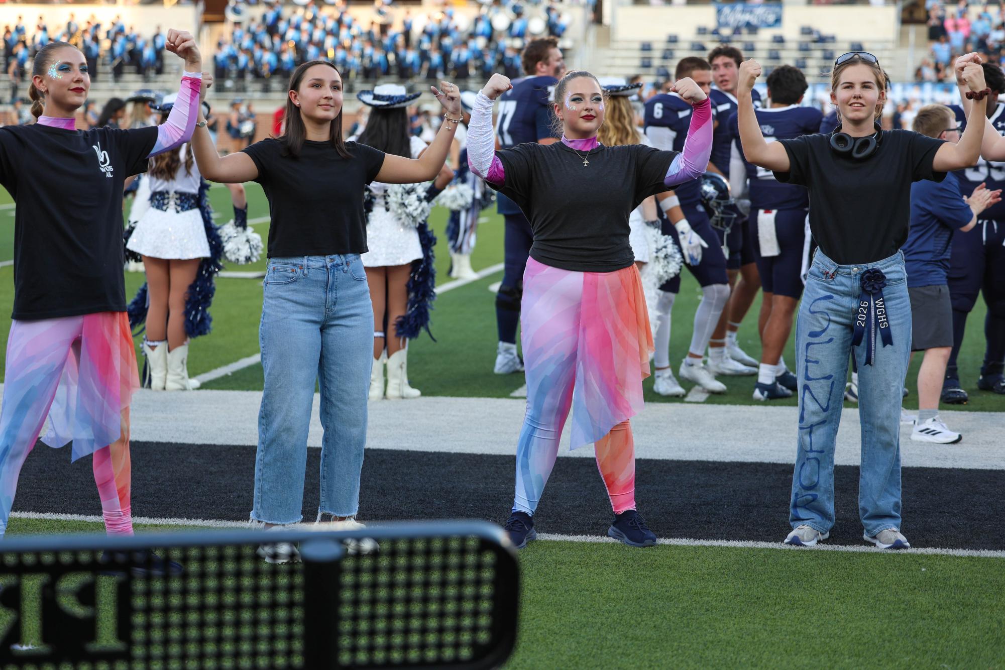 At Children's Health Stadium on September 13, (Left to right) Rissa Warren, Bella Bruce, Jillian Hees, and Lindsay Moffatt sign the national anthem to spread Deaf awareness and to accommodate anyone who may need the signed version of the National Anthem. “Although it can be difficult to sign at the same pace as everyone else,” Lindsay Moffatt said. “signing the national anthem is really fun and fulfilling because I think showcasing the beauty of ASL is important.”