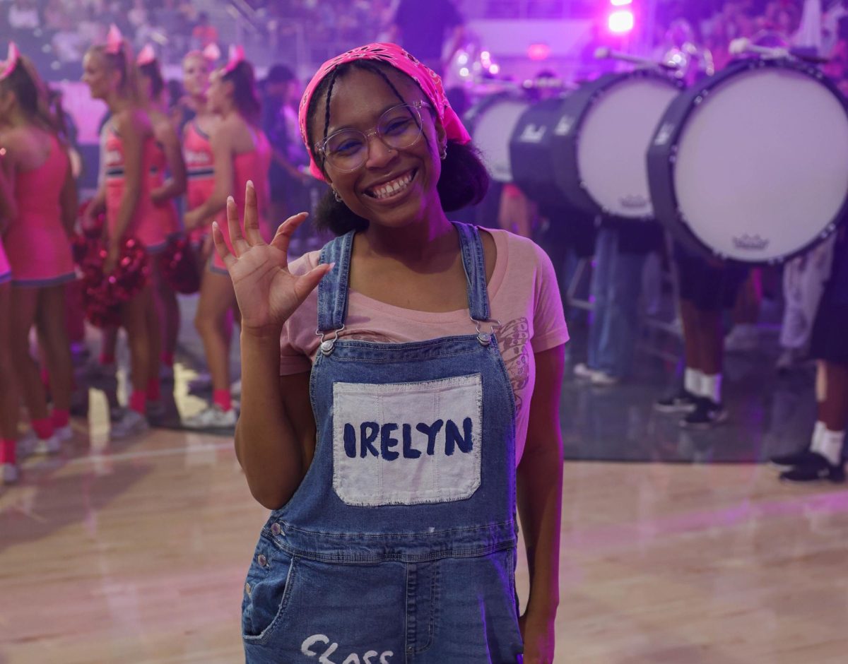 Irelyn happily holding the Wildcats hand symbol, during the pink out pep rally on Oct. 2