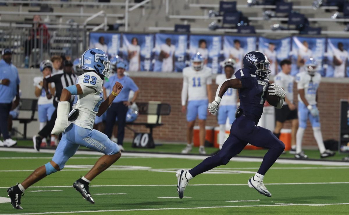 Running back Cam Newton on a breakaway run against Emerson.