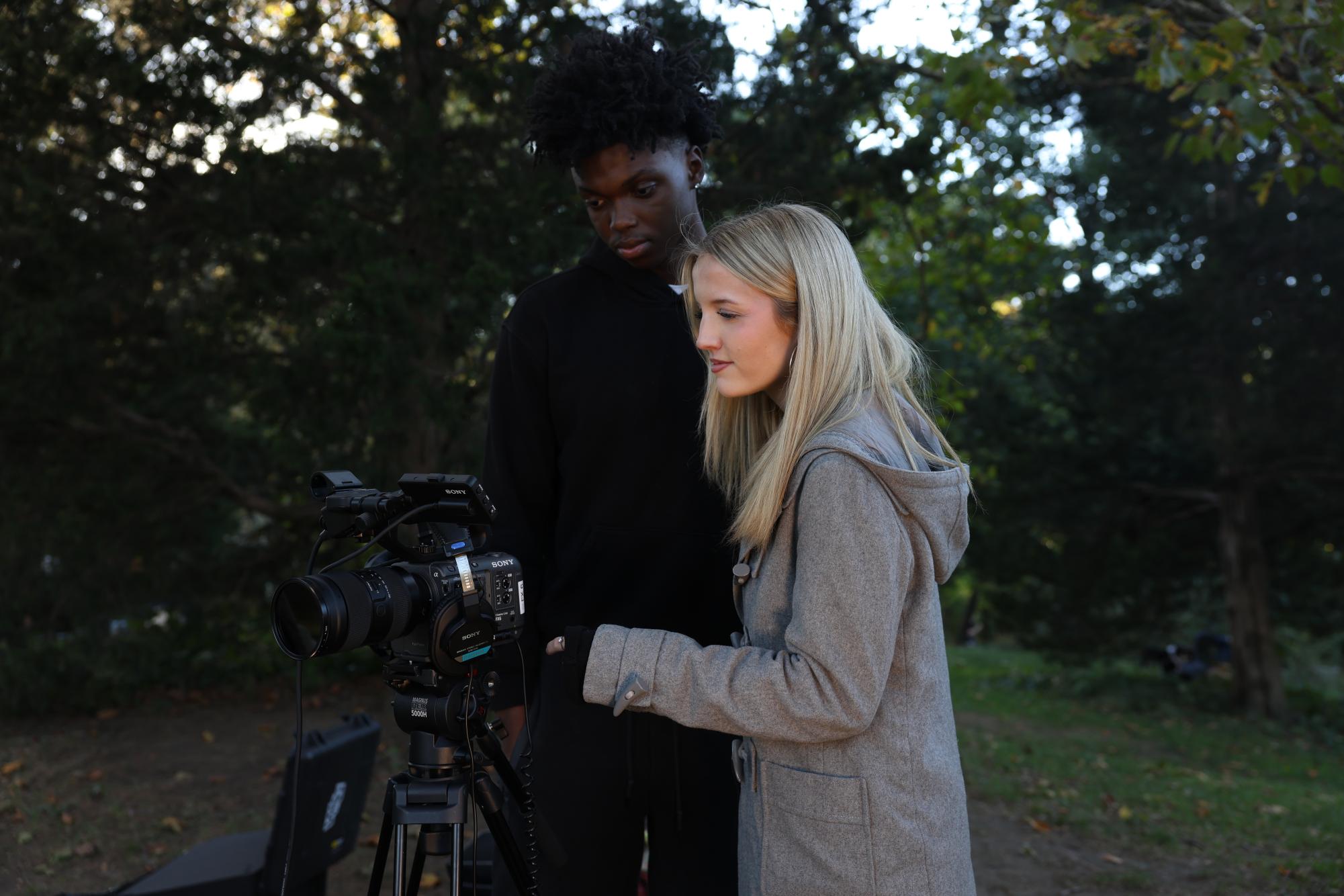 Director Olivia Pacini and camera operator Nathan Smith review the shot of a break up scene in Central Park.